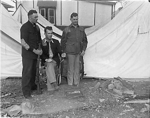 Three members of Sydney Rifle Club outside their tent
