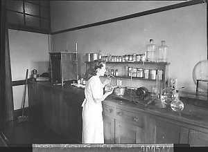 Laboratory technician testing wheat and flour at the Ag...