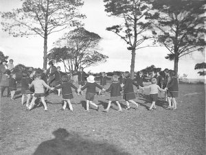 Girl Guides playing games with children, Dalwood Home