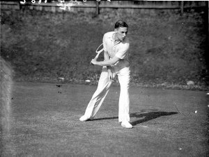 Tennis player Vernon G. Kirby in action