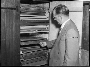 Town Clerk, Mr Burges, with paintings (Pote Collection)