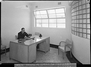 Manager at his desk, Pabco Products (for Building Publi...