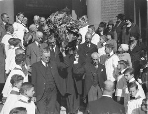 Politicians pall-bearers carry coffin from church.  W.M...