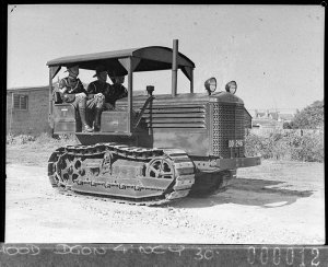 Tractor with driver and two assistants, at Randwick Dri...