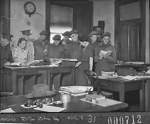 Servicemen and a servicewomen in the ACF office (taken ...