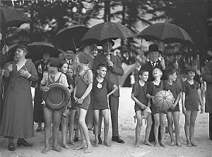 Kids in their bathers in heavy rain