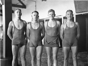 Four male swimmers, (Noel Ryan 3rd from left, Sam Herfo...