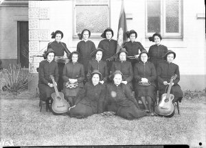 Group of 13 Salvation Army women with their musical ins...