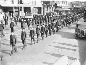 Uniformed tramwaymen leading the procession