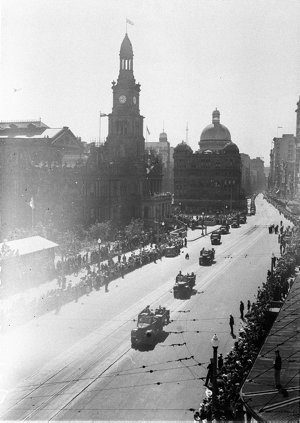 Army trucks parade along George Street, past the Queen ...