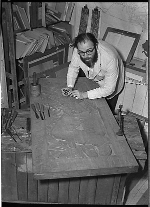 Mr Paul Beadle, sculptor, with maple bas-relief commiss...