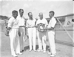 Group of five tennis players with trophy shield, White ...