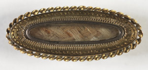 Brooch containing lock of Sir Henry Parkes' hair, 1890