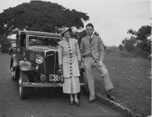 Mrs Stilling & unidentified man beside her Standard car