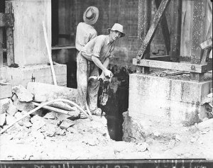 Workmen using jack-hammers