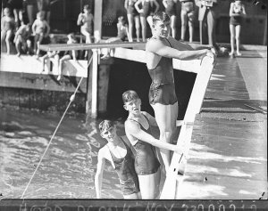 Three young men swimmers
