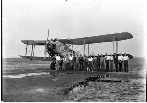 Group in front of De Havilland DH 61 "Canberra" (biplan...
