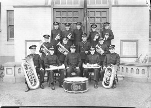 Fourteen male Savation Army officers with their musical...