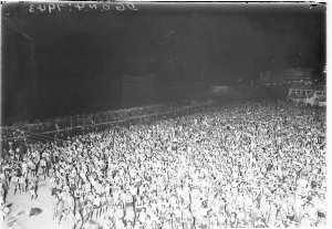 Huge crowd of surfers on Coogee Beach at night