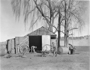 Wheelwrights working on a wagon wheel at Berridale, nea...