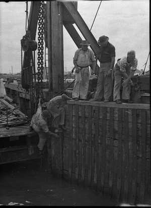 Main Roads Dept. workmen repair damage caused when the ...