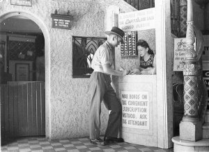 A young soldier signs a pledge for war bonds and receiv...
