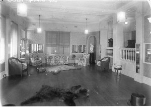 The lounge room; showing two huge bear rugs, and an ala...