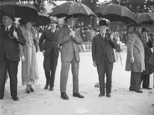 Governor Sir Philip Game under his umbrella in the rain...