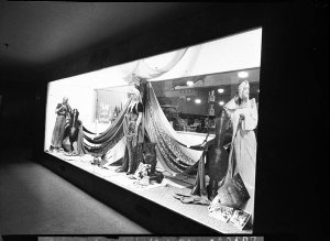 A window display of drapes and fabrics