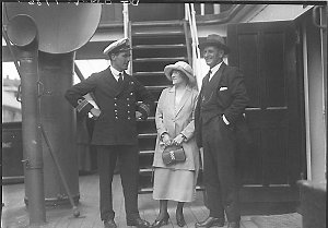 Shipboard picture of couple talking with a Deck Officer