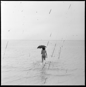 File 28: Girl in bathing with umbrella, December 1963 /...
