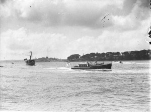 Small naval pinnace leads steam launch with the Governo...
