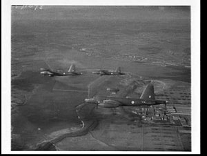 Three RAAF Lockheed Neptune bombers return from a round...