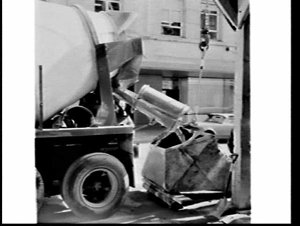 Moulang cement trucks deliver cement to an office build...