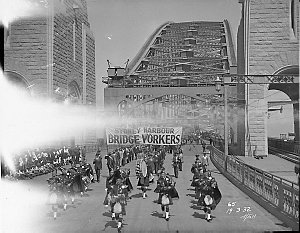Sydney Harbour Bridge Workers march behind a pipe band,...