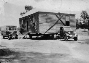 Moving a house by Chevrolet. Deniliquin's first bus on ...