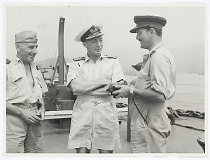 Commodore J.A. Collins, on board his flagship, H.M.A.S....