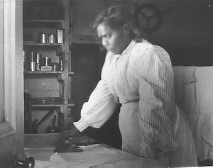 Aboriginal maid ironing at 'Kaleno' station - Bourke, N...