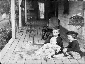 Children playing on homestead veranda, `Kroombit' prope...
