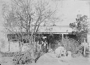 Alma homestead with owners and servant girl in backgrou...