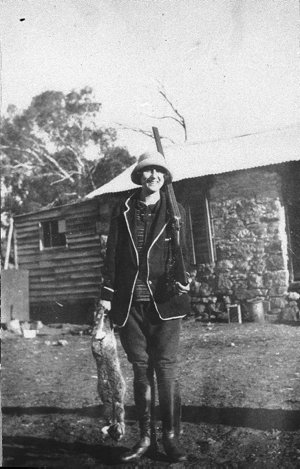 Woman with shotgun and hare - Probably Quakers Hill, NS...