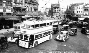 Kings Cross showing trolley bus, trams and cars - Sydne...