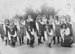 Schoolgirls exercising with sticks - Deniliquin, NSW