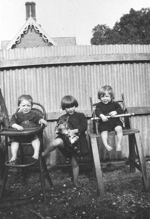 Children in highchairs, back of Dr Elliott's home - Alb...
