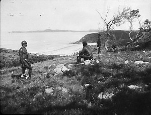 Three Aboriginal men on hill above Shark Beach (Bonny Hills) - Port Macquarie area, NSW