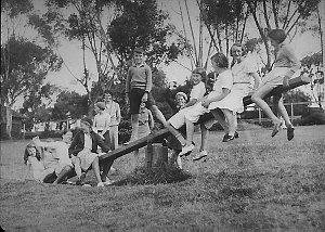 Group of children playing on a see-saw in Footscray Par...