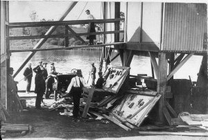 Model T Ford being unpacked on Kempsey Wharf. These car...