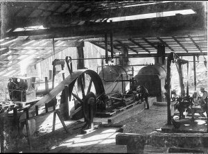 Interior of mill, showing steam engine to power saws an...