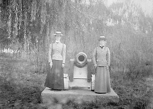Two women standing next to a cannon (in a soldierly stance) at Botanical Gardens - Ballarat, VIC