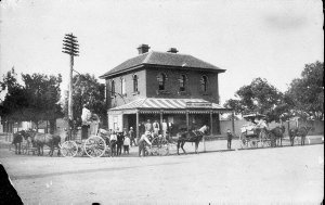 Coach and wagons outside Post & Telegraph Office. Thoma...